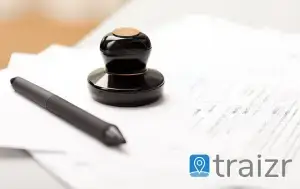 Legal document with gavel stamp, pen and Traizr logo representing secure document tracking for law firms