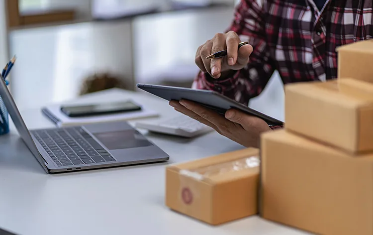 A reception team greeting visitors while parcels are handled by a system